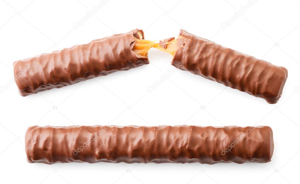 Chocolate sticks whole and halves on a white background. The view from top