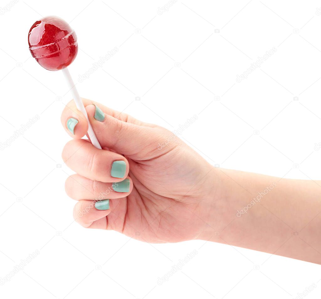Lollipop in a man's hand close-up on a white background. Isolated