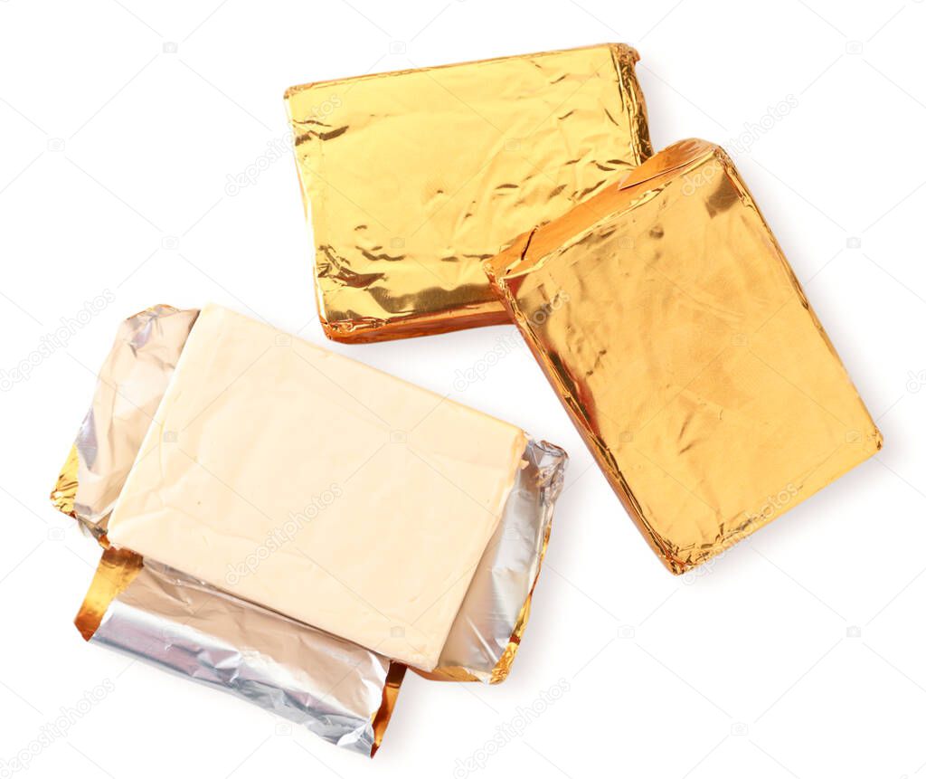 Rectangular melted cheese in packing and without packaging on a white background isolated. The view from top