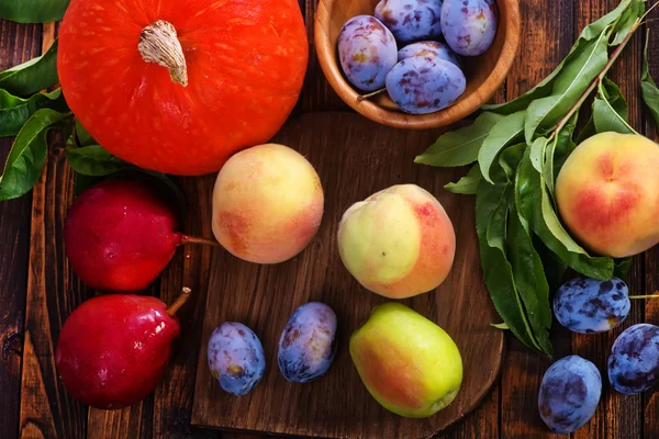 Autumn fruits on table — Stock Photo, Image