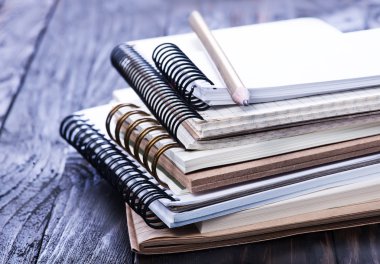 Stack of spiral notebooks clipart