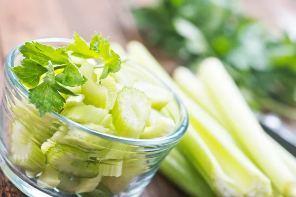 Fresh celery in glass bowl — Stock Photo, Image