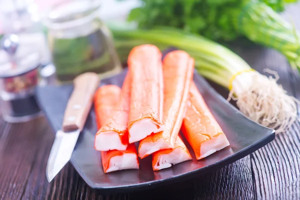 Crab sticks on plate — Stock Image Crab sticks on plate Stock Photo