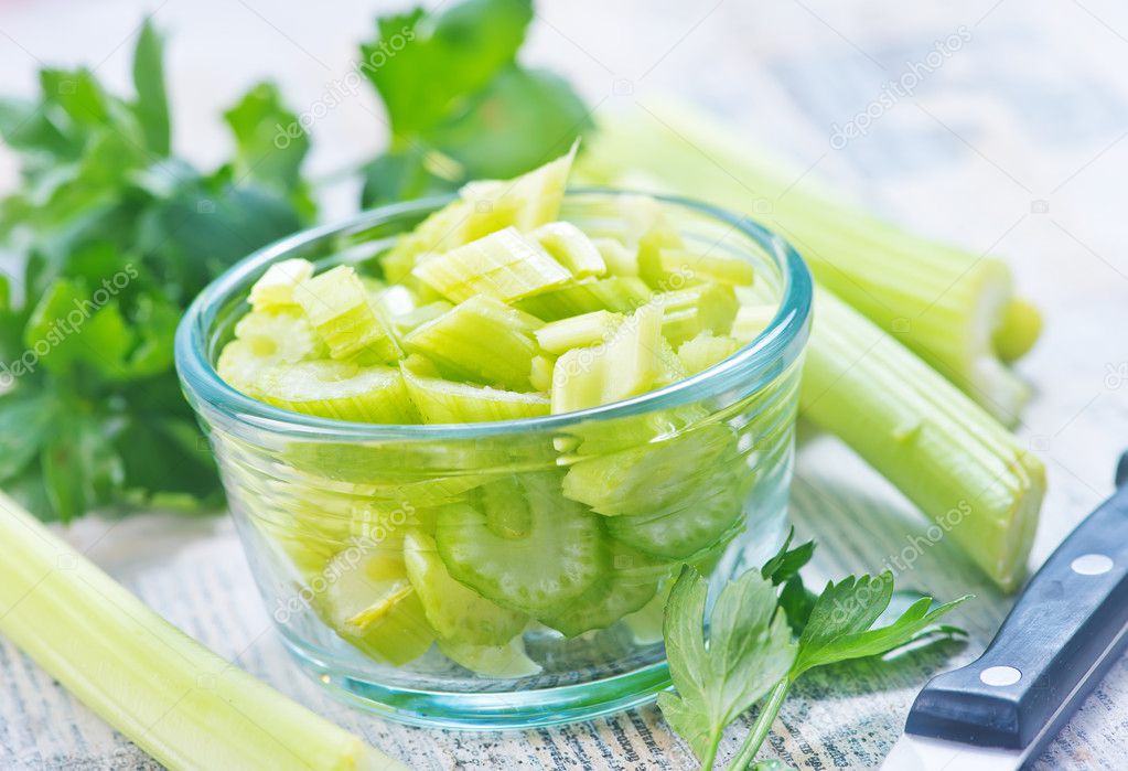 fresh celery in glass bowl