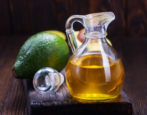 Avocado oil in glass — Stock Photo, Image