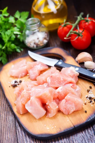 Chicken fillet on wooden board — Stock Photo, Image