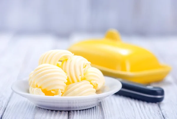 Butter on white plate — Stock Photo, Image