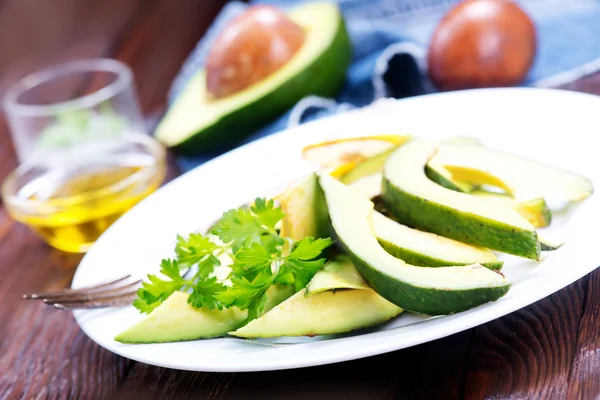 Avocado salad on white plate — Stock Photo, Image