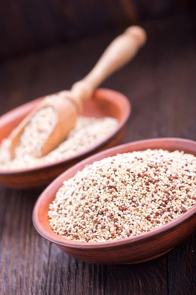 Raw quinoa in bowls — Stock Photo, Image