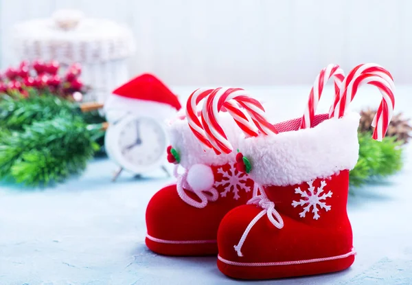 Boots with candy canes — Stock Photo, Image