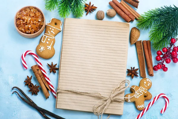 Notebook with cookies and candycanes — Stock Photo, Image