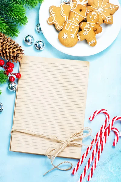 Cookies and candy canes on a table — Stock Photo, Image
