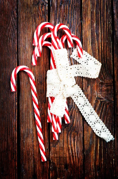 Candy canes with white ribbon — Stock Photo, Image