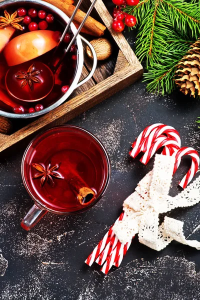 Christmas drink with aroma spices and decoration — Stock Photo, Image