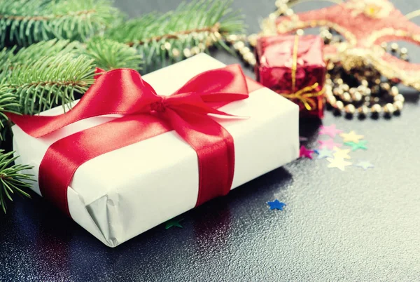 Gift with red ribbon — Stock Photo, Image