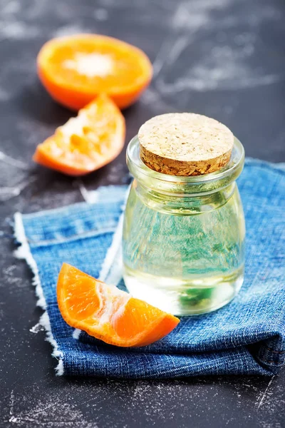 Orange oil in glass bottle — Stock Photo, Image