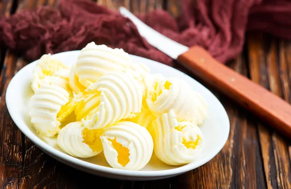 Fresh butter on plate — Stock Photo, Image