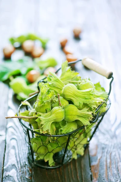 Hazelnuts on wooden table — Stock Photo, Image