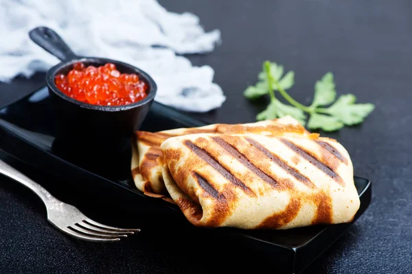 Grilled pancakes with caviar — Stock Photo, Image
