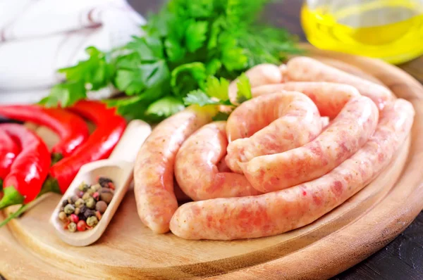 Raw meat sausages — Stock Photo, Image