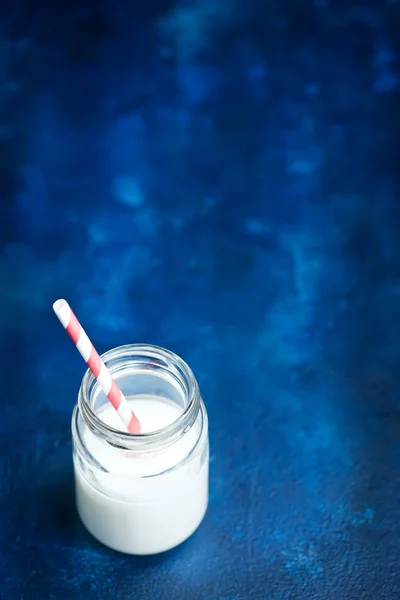 Milk in bank with straw — Stock Photo, Image