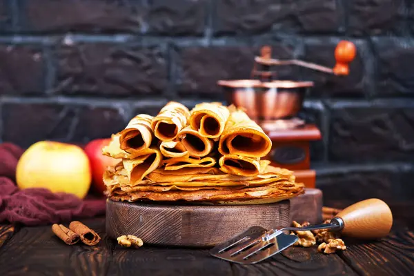 Pancakes on wooden board — Stock Photo, Image