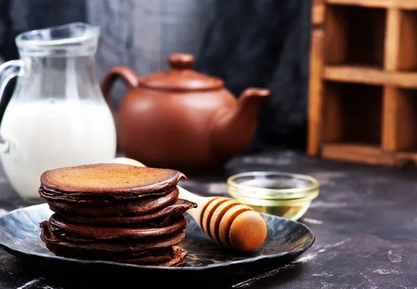 Chocolate pancakes on plate — Stock Photo, Image