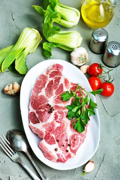 Raw meat on plate — Stock Photo, Image