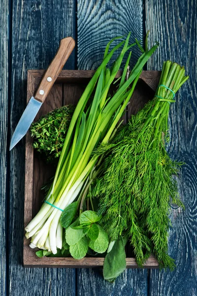 Fresh greens in wooden box — Stock Photo, Image