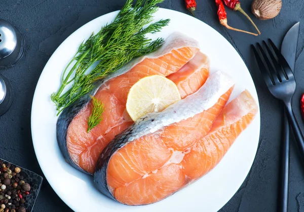 Plate with salmon on table — Stock Photo, Image