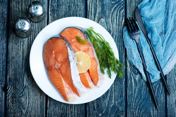 Plate with salmon on table — Stock Photo, Image