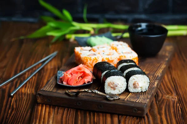 Sushi set on wooden board — Stock Photo, Image