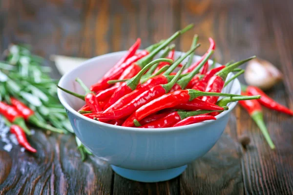 Red hot chili peper op tafel — Stockfoto