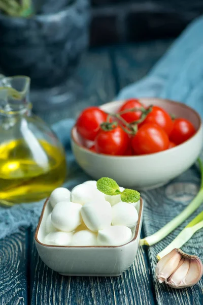 Mozzarella in bowl  on a table — Stock Photo, Image