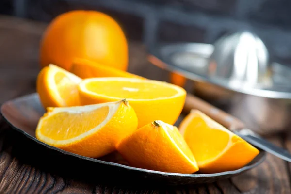 Fresh oranges on the wooden board — Stock Photo, Image