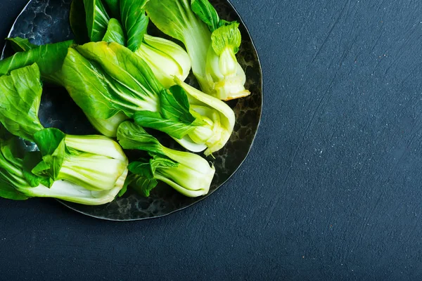 Fresh pak choi on plate — Stock Photo, Image