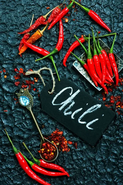 Chili peppers on table — Stock Photo, Image