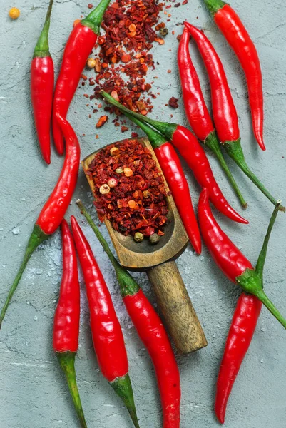 Chilli peppers on table — Stock Photo, Image