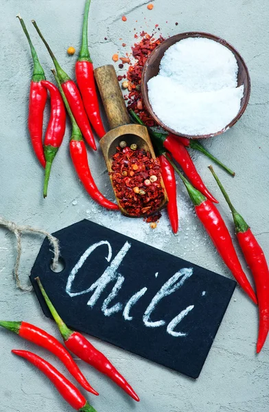 Chilli peppers on table — Stock Photo, Image