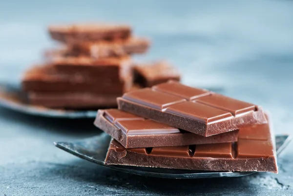 Chocolate and cacao on plate — Stock Photo, Image