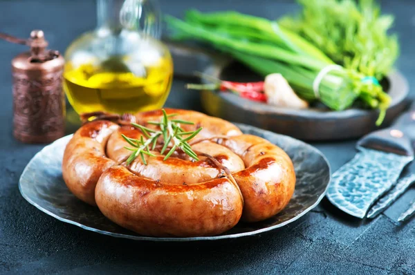 Fried sausages with spices — Stock Photo, Image