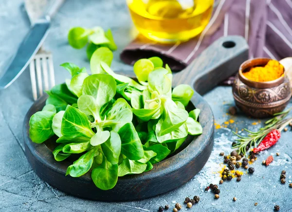 Corn salad on wooden board — Stock Photo, Image