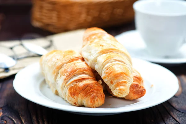Croissants on white plate — Stock Photo, Image