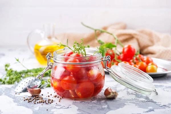 Canned tomatoes with spices and salt in jar — Stock Photo, Image