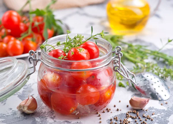 Canned tomatoes with spices and salt in jar — Stock Photo, Image