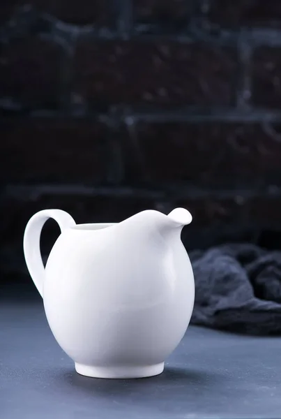 Fresh milk in white jug — Stock Photo, Image