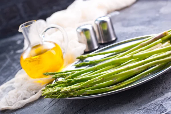 Asparagus with spices on table — Stock Photo, Image