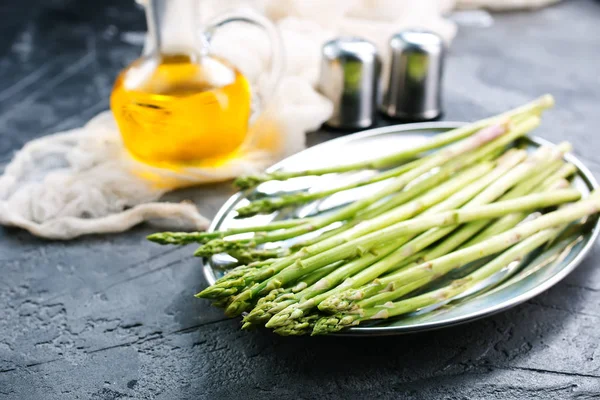 Asparagus with spices on table — Stock Photo, Image
