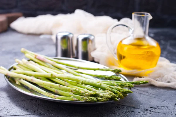 Asparagus with spices on table — Stock Photo, Image