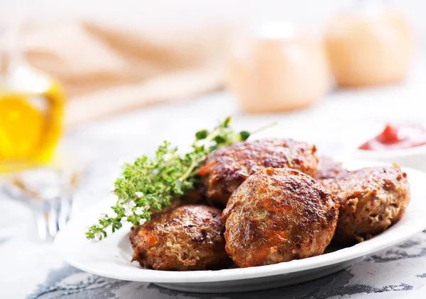 Meatballs with herbs on plate — Stock Photo, Image